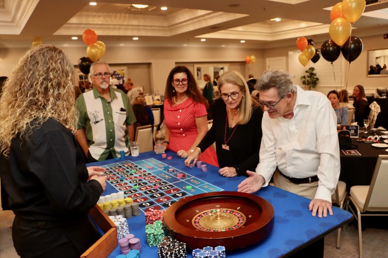 Hoping their lucky number comes up on the roulette wheel are (l-r) Tom Donovan, Renata Andreani, Karen Morgan and John Morgan.